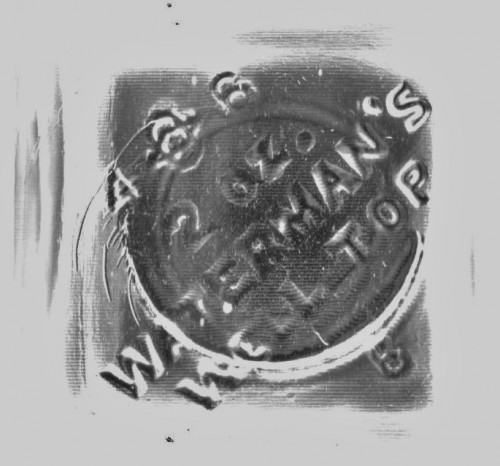 27. WT. Inscription molded into the bottom of the bottle - SCAN.jpg